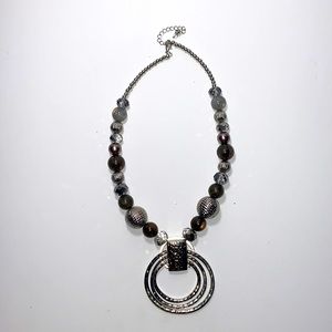 Gray and silver colored necklace